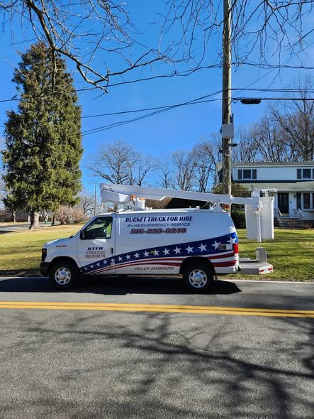Our wrapped bucket van parked along a road with the boom stowed